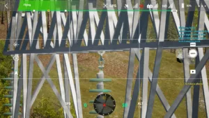 Drone simulator screenshot inspecting the middle crossarm attachment of a 220kV linear tower
