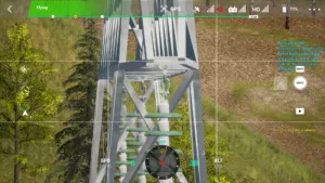 Drone simulator screenshot inspecting the right crossarm attachment of a 220kV linear tower