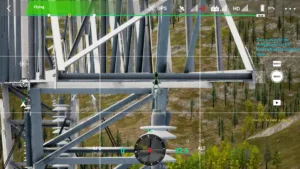 Left-phase cross-arm connection of 500 kV pull tower shown in drone simulator.