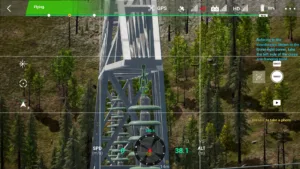 Drone simulator screenshot inspecting the left crossarm attachment of a 220kV linear tower
