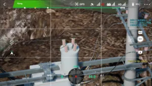 Top-mounted switch of a 10kV terminal pole displayed in UAV-based power inspection simulator.